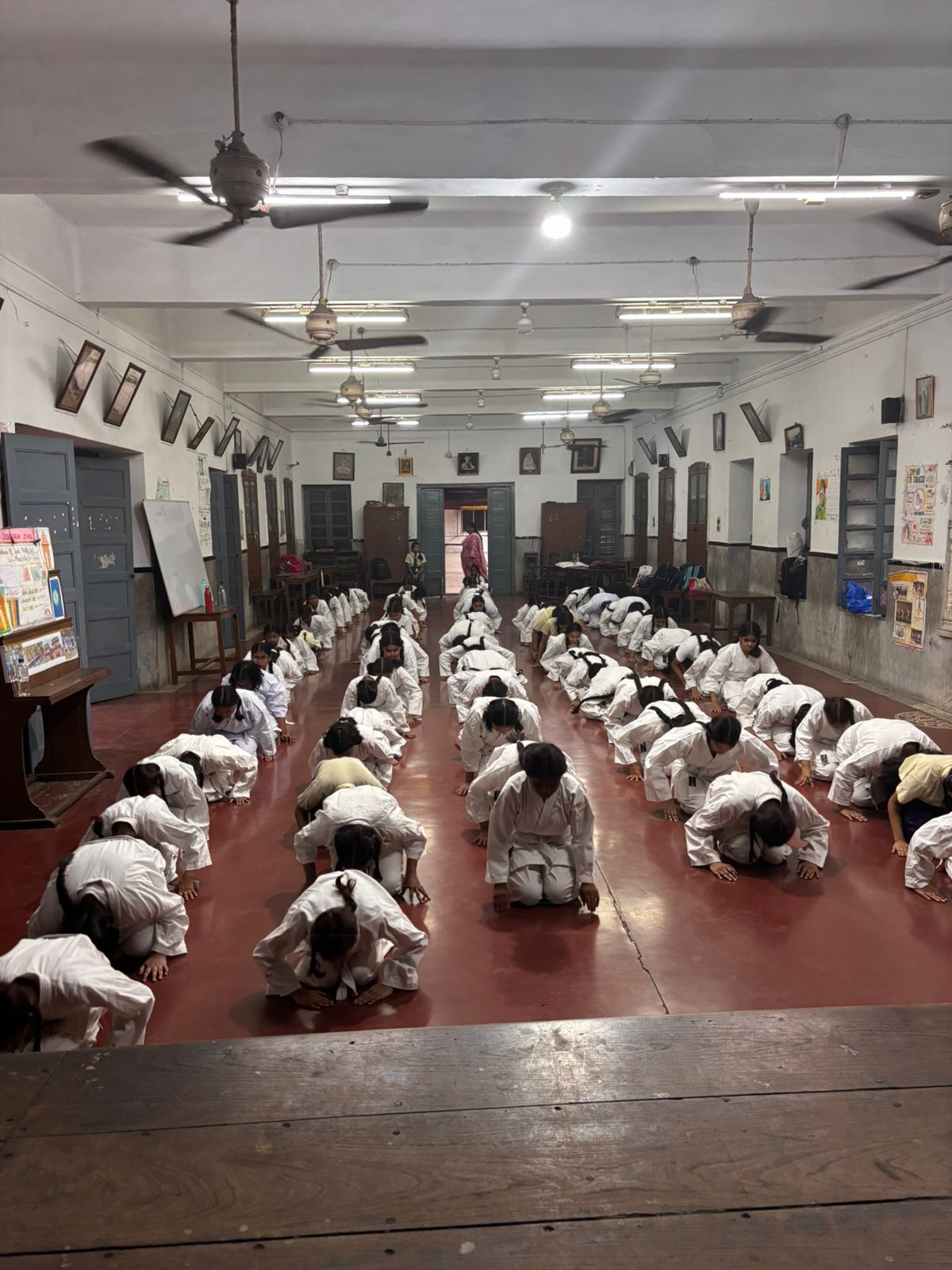 Coach guiding students