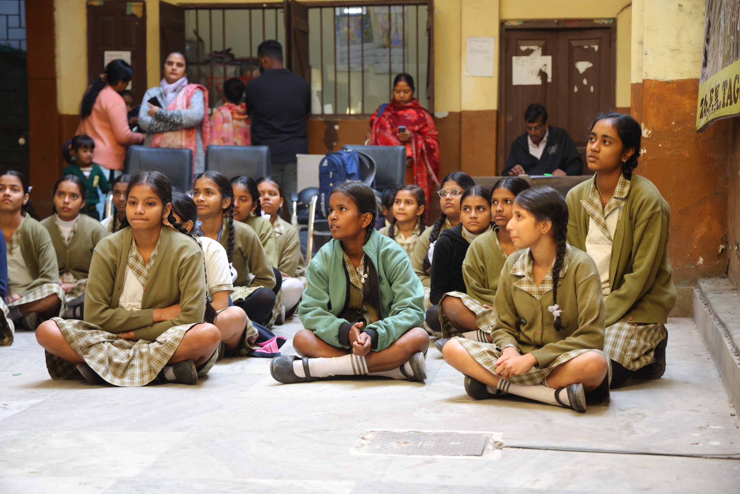 Dedicated head coach guiding girls in martial arts stances